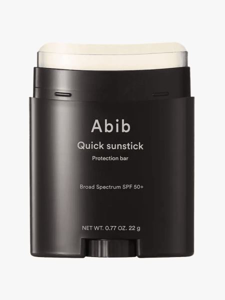Abib Quick Sunstick Protection Bar SPF50+ in branded component on a light gray background