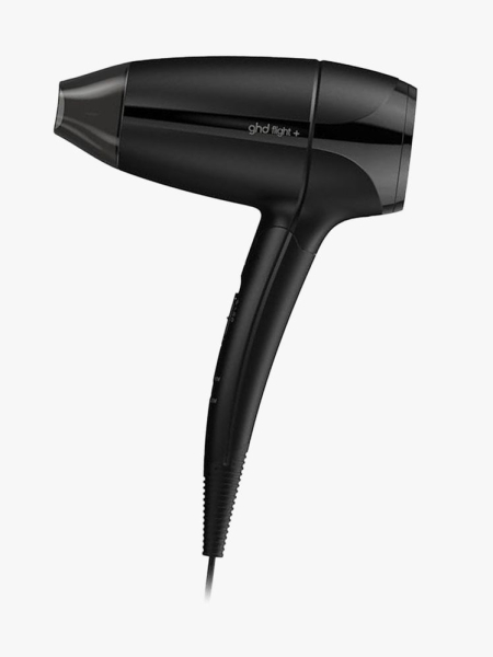 A black GHD Flight+ Travel Hair Dryer on a white background